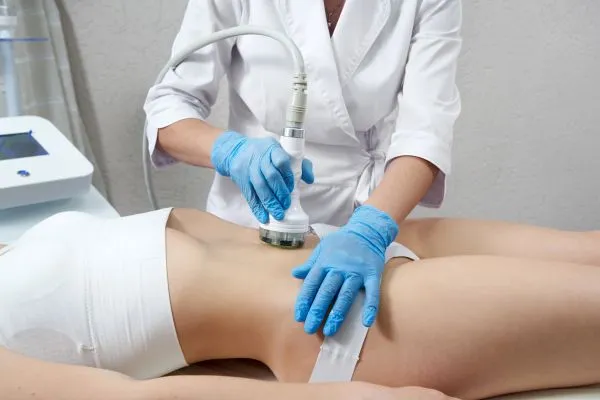 Lost the Weight but Not the Loose Skin? 2 woman having HIFU treatment on her stomach to combat loose skin Selston following weight loss